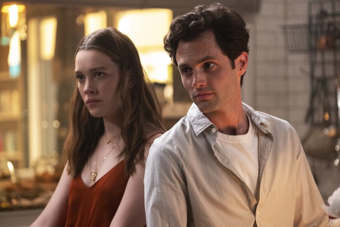 Love Quinn and Joe Goldberg stand in a kitchen