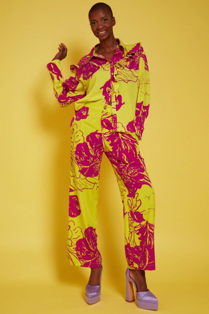 Woman wearing yellow and red statement jumpsuit