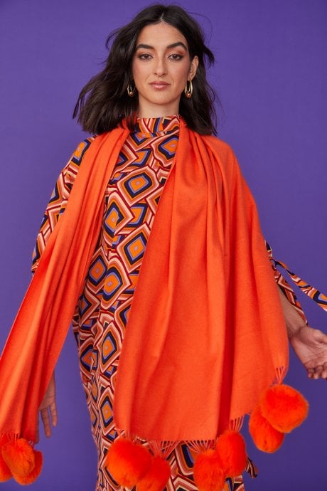 Cashmere blend wrap with love heart poms in Orange
